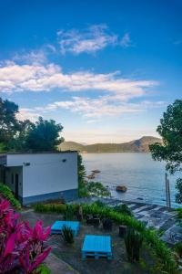 a view of a body of water with a building at Pousada Piquara in Mangaratiba