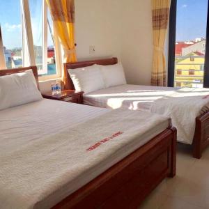 Postel nebo postele na pokoji v ubytování Thanh Dat 2 Hotel