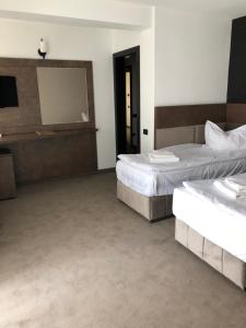 Postel nebo postele na pokoji v ubytování Hotel Corsa + 37 fotografií