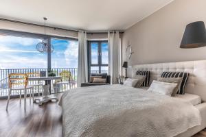 Posteľ alebo postele v izbe v ubytovaní Apartament Prestige & Sea Horyzont 613