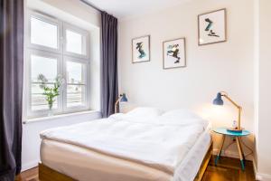 Posteľ alebo postele v izbe v ubytovaní NOVUMHOUSE - Tomasza