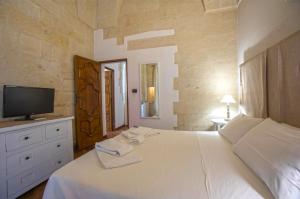 Voodi või voodid majutusasutuse Chiesa Greca Suites - Lecce Selection toas