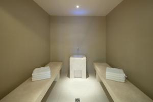 a small room with two benches and a box at Hotel Penz West in Innsbruck
