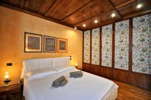 Postel nebo postele na pokoji v ubytování Crotto Polirolo - The House Of Travelers