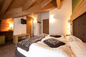 Postel nebo postele na pokoji v ubytování Hotel Vedig
