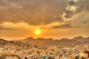 a view of a city at sunset at Valentine Inn in Wadi Musa