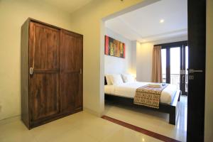 Ein Bett oder Betten in einem Zimmer der Unterkunft Nyoman Villa Sanur