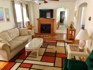 a living room with a couch and a fireplace at Sea Kist Motel in Wildwood