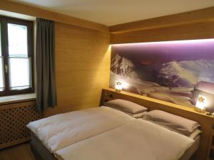 Postel nebo postele na pokoji v ubytování Hotel Compagnoni