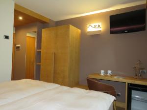 Postel nebo postele na pokoji v ubytování Hotel Compagnoni