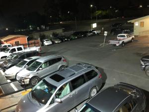 a parking lot with a lot of cars parked at Valley Inn in Watsonville