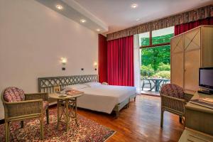 Posteľ alebo postele v izbe v ubytovaní Park Hotel Junior