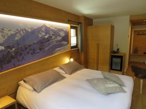 Postel nebo postele na pokoji v ubytování Hotel Compagnoni