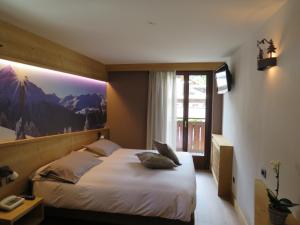 Postel nebo postele na pokoji v ubytování Hotel Compagnoni