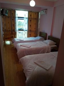 Postel nebo postele na pokoji v ubytování NNN Tourist