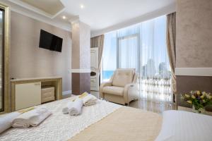 Ένα ή περισσότερα κρεβάτια σε δωμάτιο στο Tropicana Resort Hotel Sochi