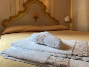 Posteľ alebo postele v izbe v ubytovaní Hotel Posta R.T.A.