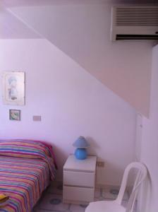 Rosa Marina Frontline Beach客房内的一张或多张床位