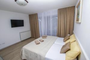 Ein Bett oder Betten in einem Zimmer der Unterkunft Guest House Katarina