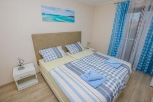 Ein Bett oder Betten in einem Zimmer der Unterkunft Guest House Katarina