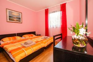 Ein Bett oder Betten in einem Zimmer der Unterkunft Guest House Katarina