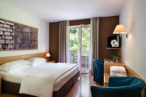Postel nebo postele na pokoji v ubytování Vital Hotel Flora