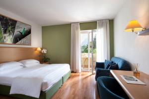Postel nebo postele na pokoji v ubytování Vital Hotel Flora