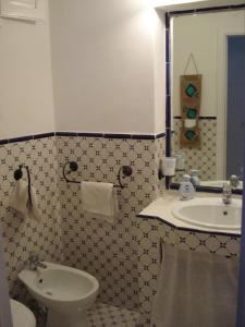 a bathroom with a sink and a toilet at Villa in Panarea - Nespolo in Panarea