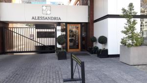 un edificio con un cartel que dice alessandra en Alessandria Apart - El Bosque Norte, en Santiago