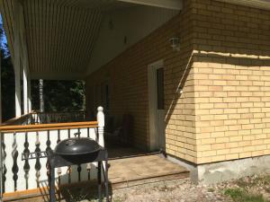 a porch with a grill on a house at Foxy burrow in Verla