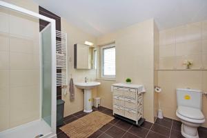 a bathroom with a toilet and a sink at Luxurious, modern and spacious apartment with terraces in Tugare +39 photos