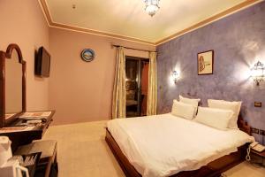 Postel nebo postele na pokoji v ubytování Amani Hotel Suites & Spa