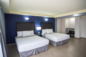 Voodi või voodid majutusasutuse Hotel Ha toas