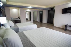 Voodi või voodid majutusasutuse Hotel Ha toas