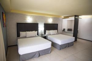 Voodi või voodid majutusasutuse Hotel Ha toas