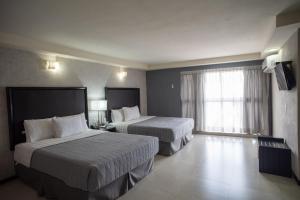 Voodi või voodid majutusasutuse Hotel Ha toas