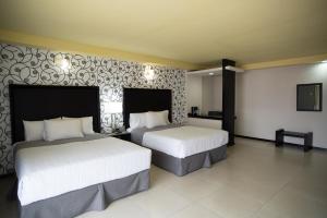 Voodi või voodid majutusasutuse Hotel Ha toas