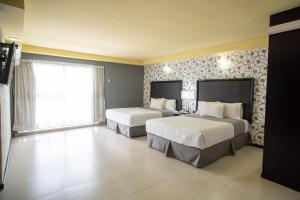 Voodi või voodid majutusasutuse Hotel Ha toas