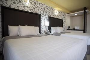Voodi või voodid majutusasutuse Hotel Ha toas