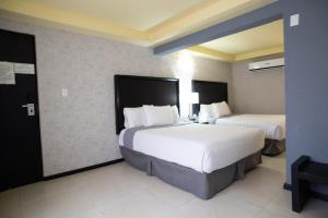 Voodi või voodid majutusasutuse Hotel Ha toas