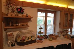 a kitchen with a table with food on it at Gästehaus Peter Wiedemann in Lenggries