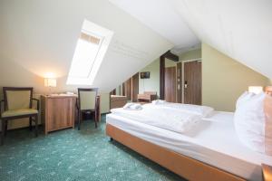 Postel nebo postele na pokoji v ubytování Hotel Saxenhof