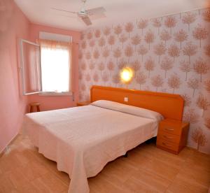 מיטה או מיטות בחדר ב-Hostal Julieta