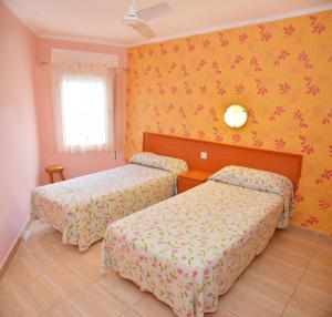 Postel nebo postele na pokoji v ubytování Hostal Julieta