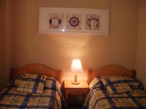 Katil atau katil-katil dalam bilik di La Peninsula Rehue