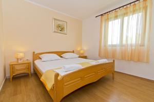 Кровать или кровати в номере Apartment Frane