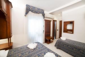Postel nebo postele na pokoji v ubytování Hotel La Giara