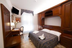 Кровать или кровати в номере Hotel La Giara