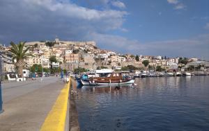 a group of boats are docked in a harbor at Evris House in Kavala