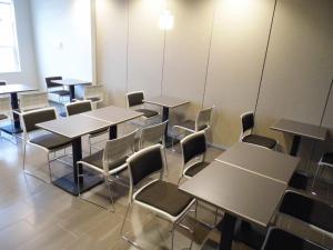 a row of tables and chairs in a room at Microtel Inn & Suites by Wyndham Vernal/Naples in Vernal